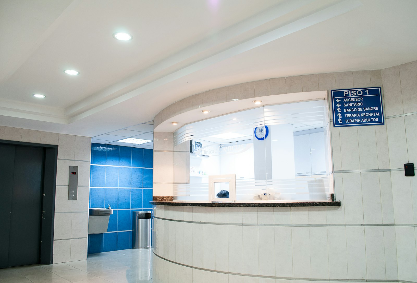 Healthcare clinic interior with warm daylight and patients waiting